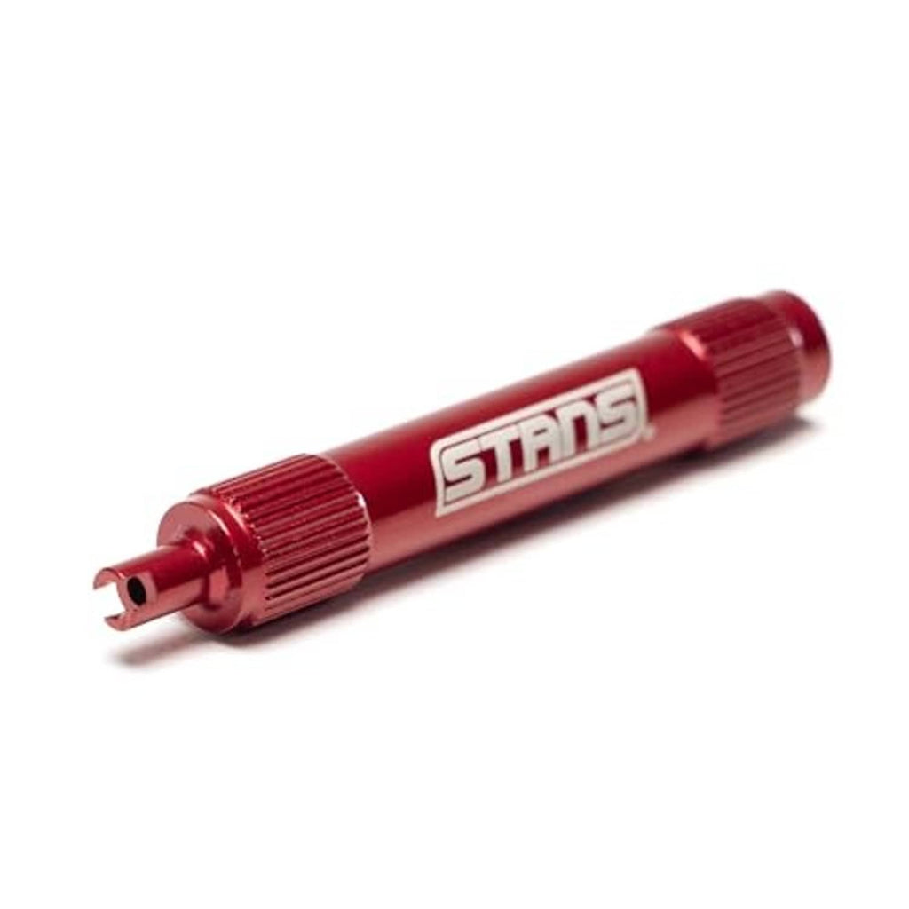Red STANS tubeless core remover tool with angled tip and ribbed end cap