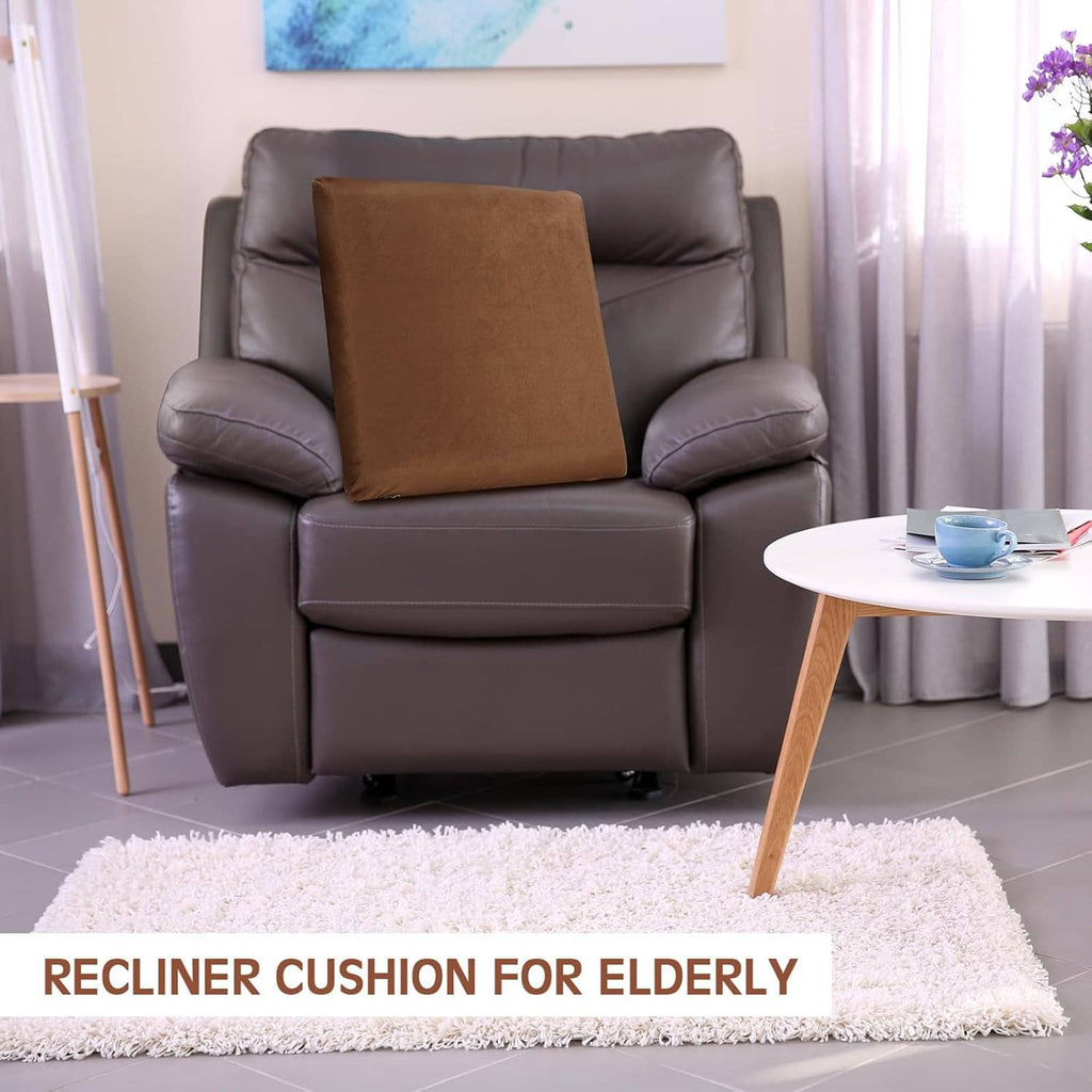Brown square recliner cushion placed on a dark gray armchair