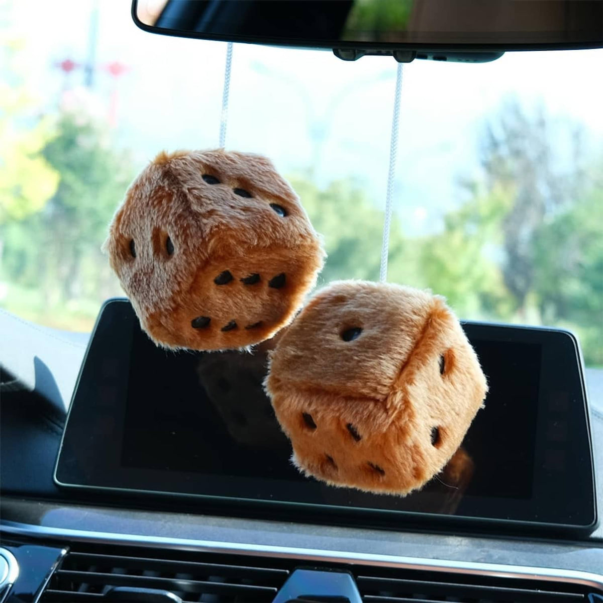Brown fuzzy plush dice pair, one face-up with black dots, hanging