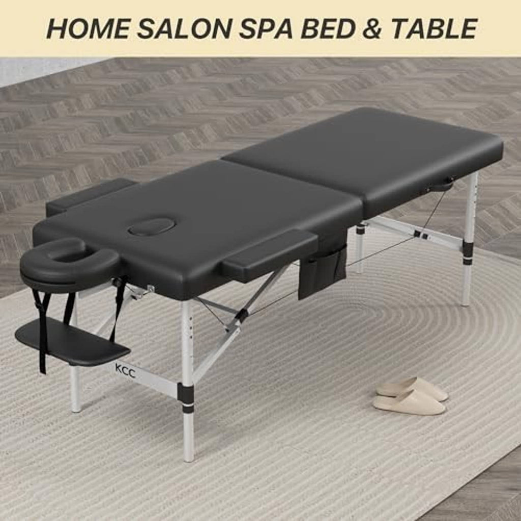 Foldable massage table with black cushions, blue head support pad, and white metal frame