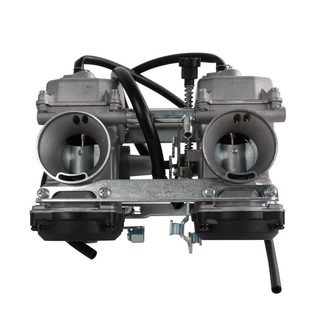 Dual carburetor with two large intake throats, black hoses, and front mounting plate