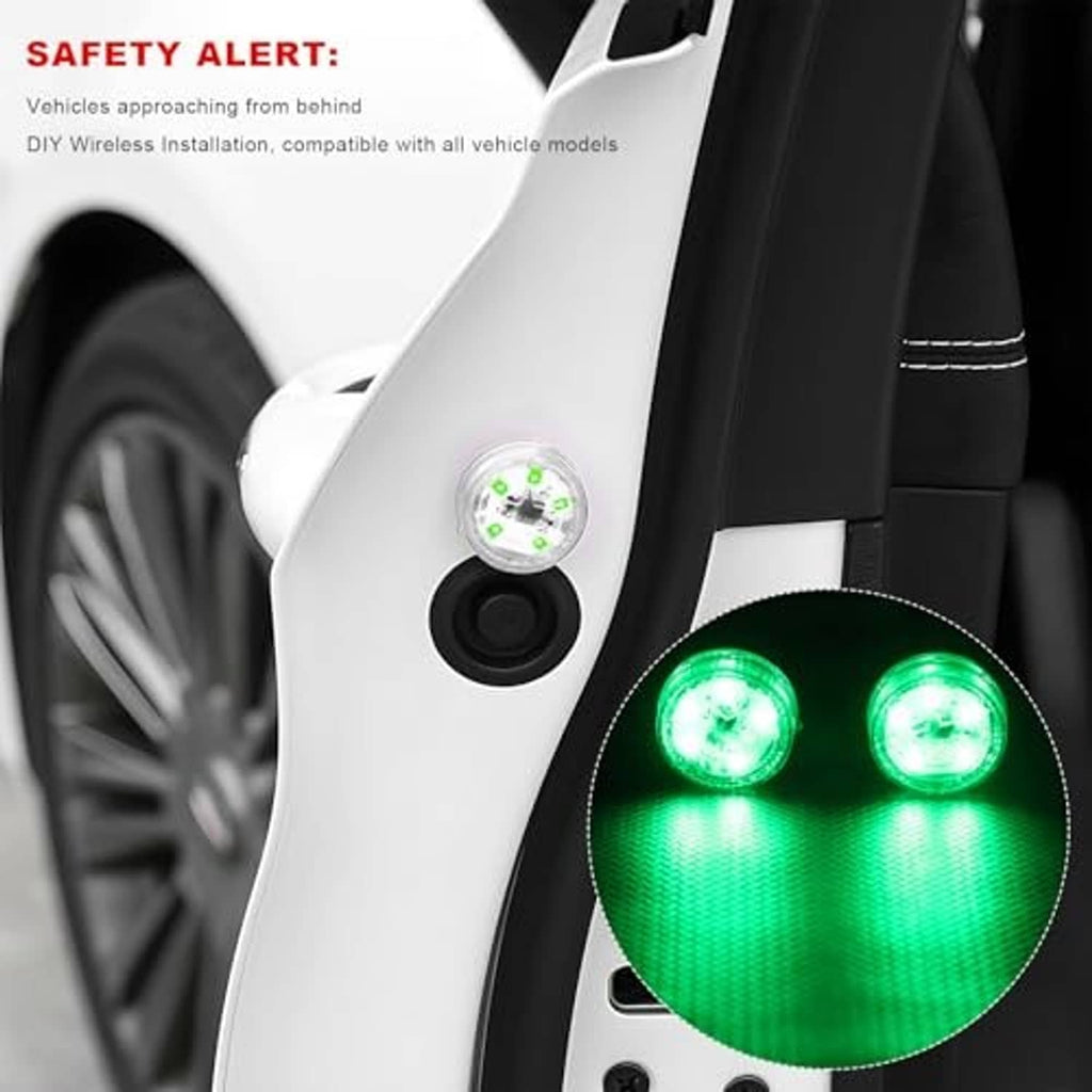 Car door with small round green LED warning lights glowing near the door edge