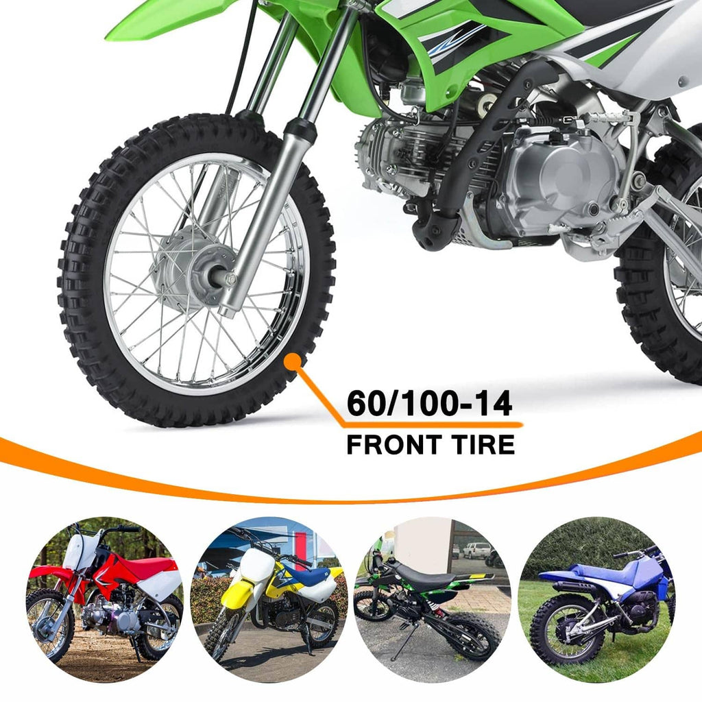 Front dirt bike wheel with knobby tire mounted on a green motorbike