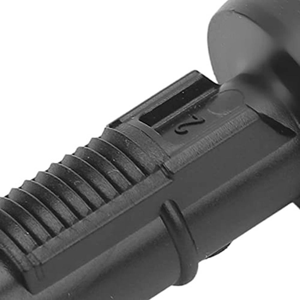Black washer nozzle housing with ribbed texture and molded marking detail