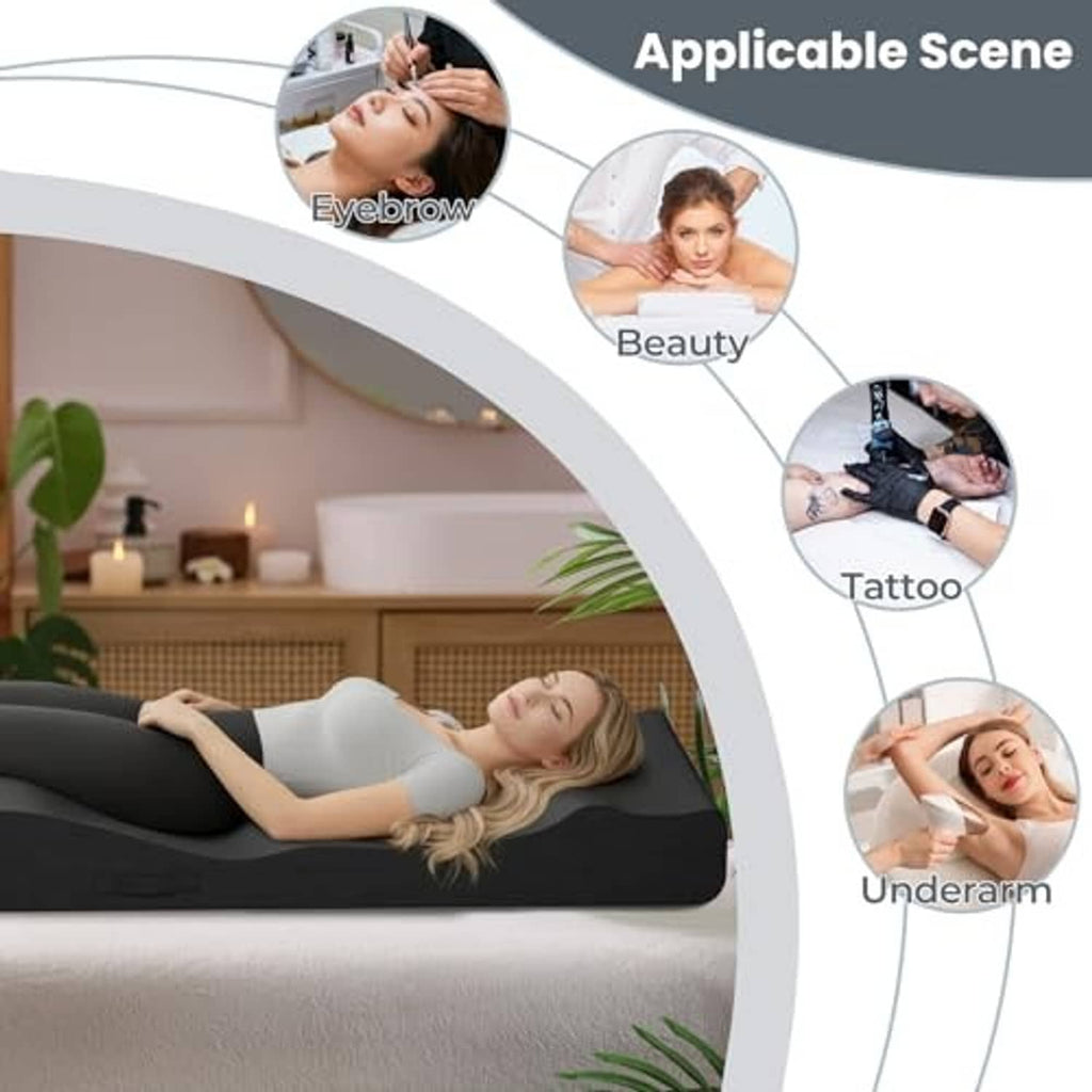 Black cushioned lash bed topper on massage table, contoured curved shape