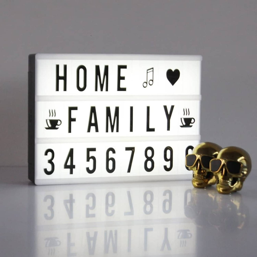 Marquee style light board reading HOME FAMILY with numbers and icons