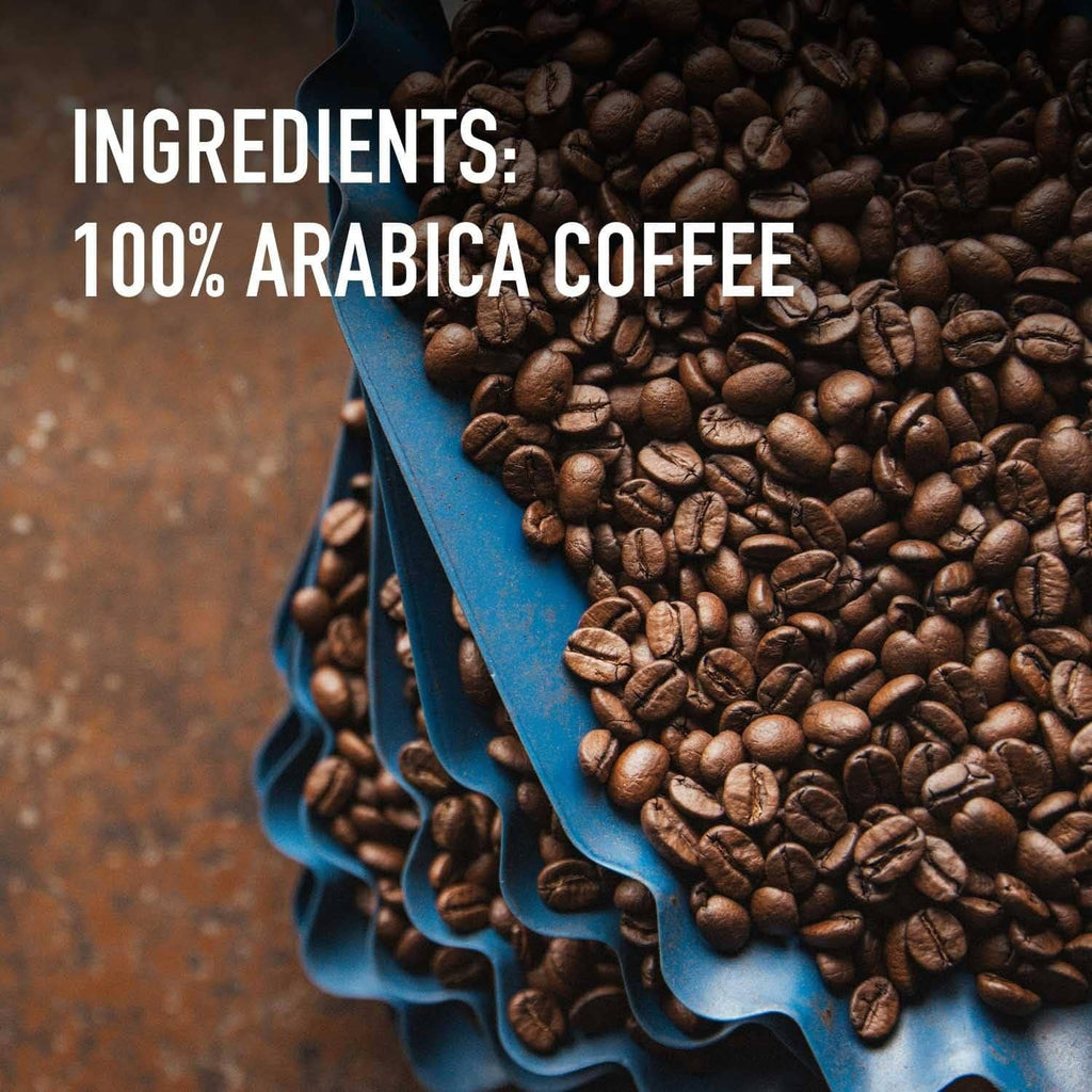 Coffee bean pile labeled 100% arabica coffee, with blue scoop