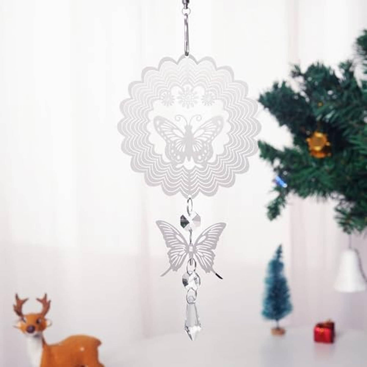 Silver sunburst and butterfly wind spinner with clear crystal drops for hanging.