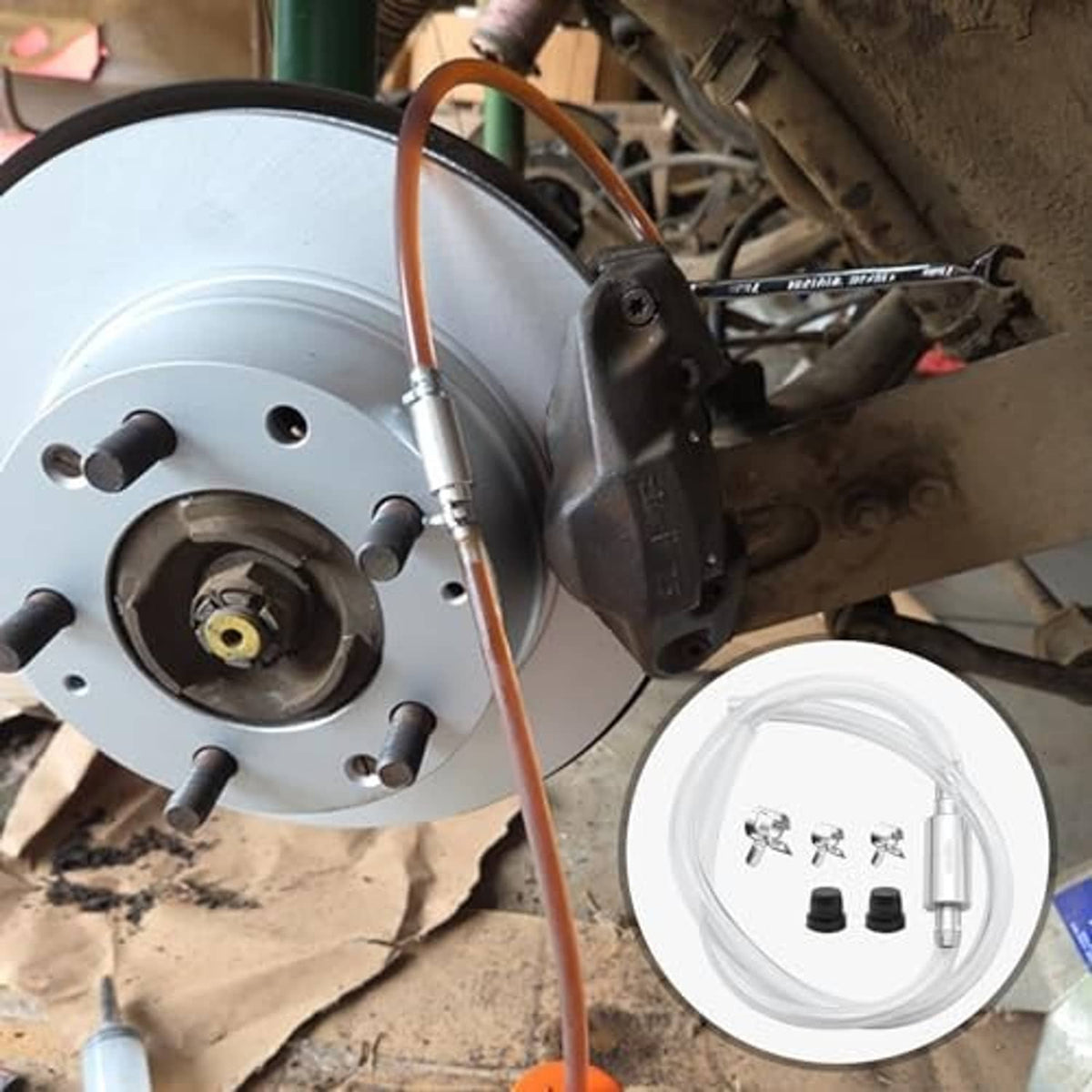 Brake hub and rotor with attached clear bleeder hose line and small bottle reservoir