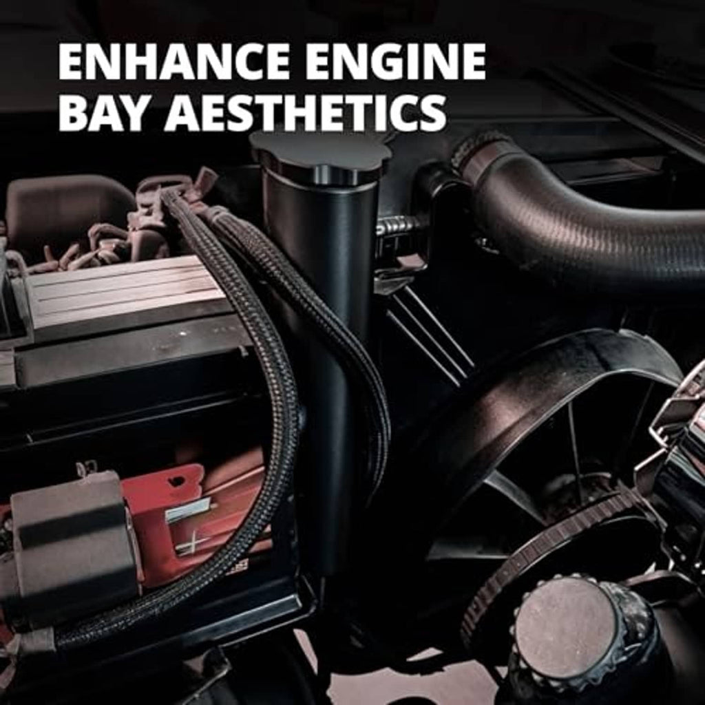 Black aluminum radiator overflow tank installed in an engine bay