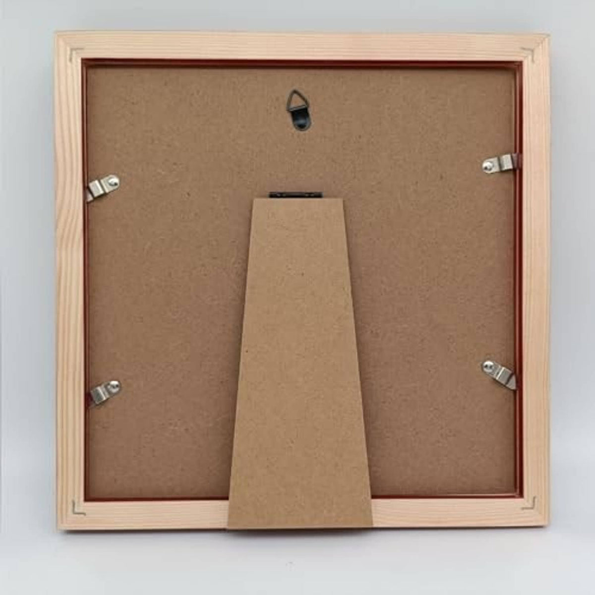 Back view of light wood picture frame with mounting clips and fold stand