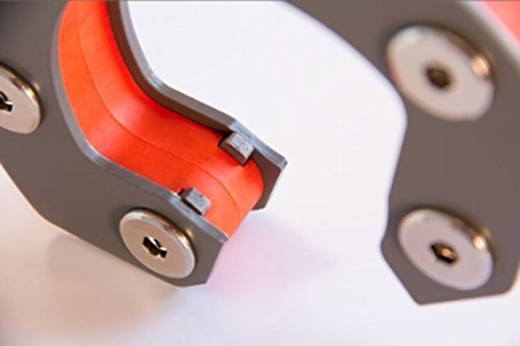 Close-up of orange-red and black hitch ball mount carrier bracket hardware