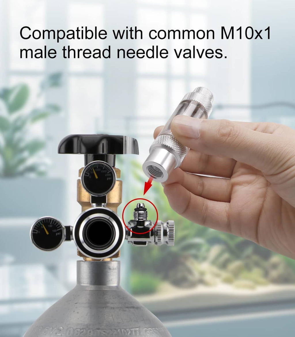 CO2 bubble counter fitting with textured silver top, shown in hand