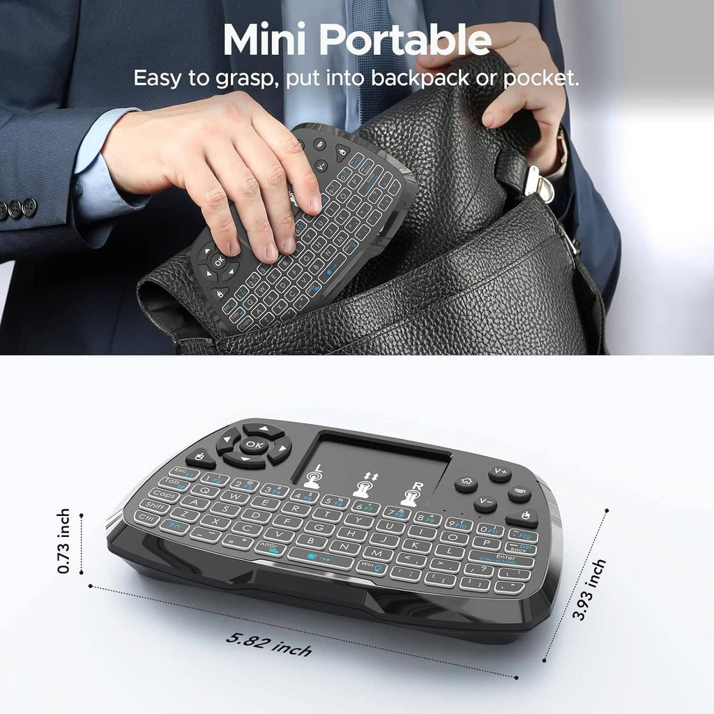 Mini black keyboard with touchpad being held and shown as pocket-sized