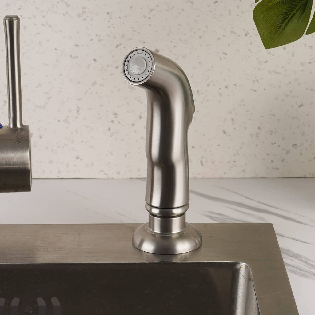 Brushed nickel sink sprayer attachment mounted on a countertop faucet with round nozzle