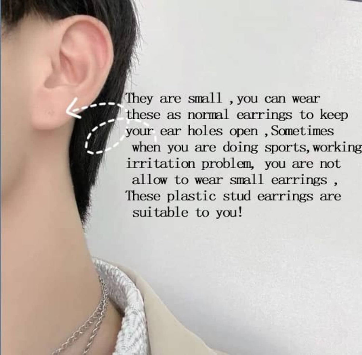 Clear plastic stud earrings on ear, tiny transparent posts with backs