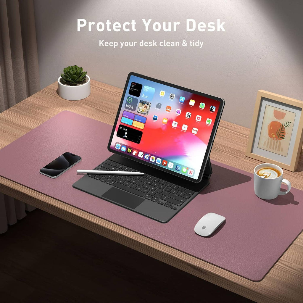 Dark pink desk pad on office table with laptop and mouse for everyday use