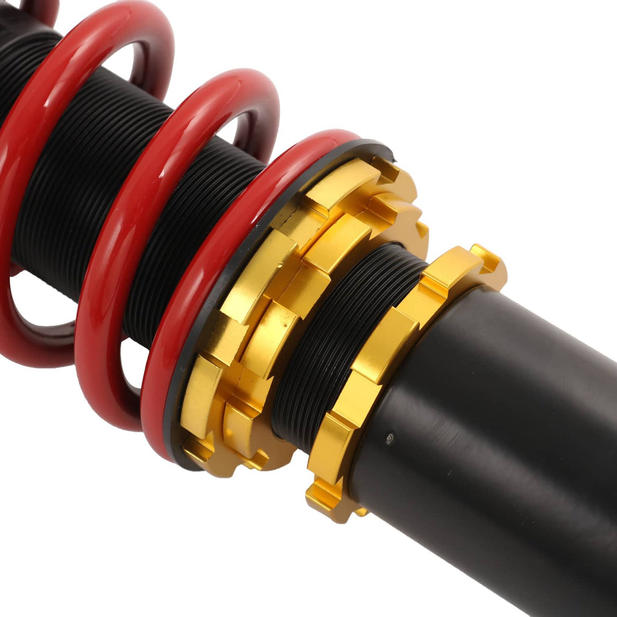 Close-up coilover strut: red spring with gold adjuster rings and black damper