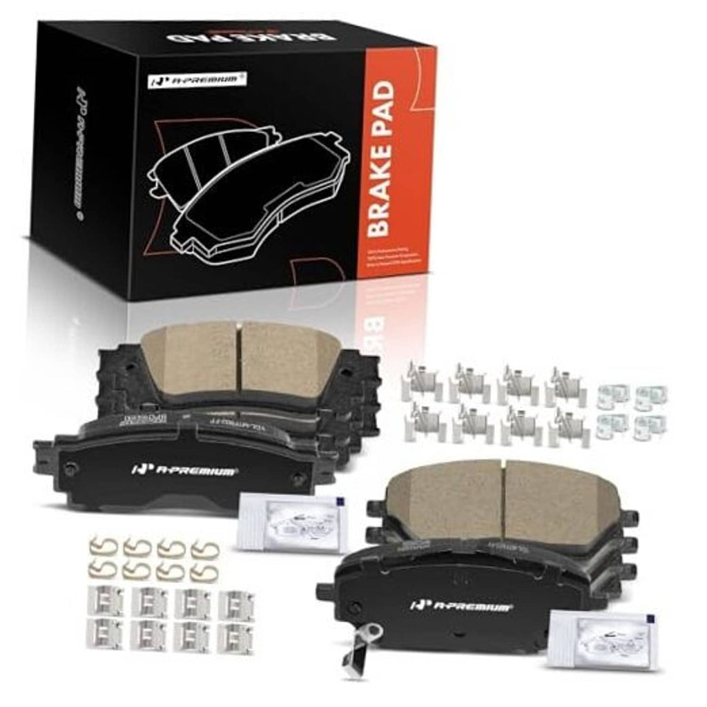 Ceramic brake pad set with beige friction inserts, mounting clips, shims, and hardware