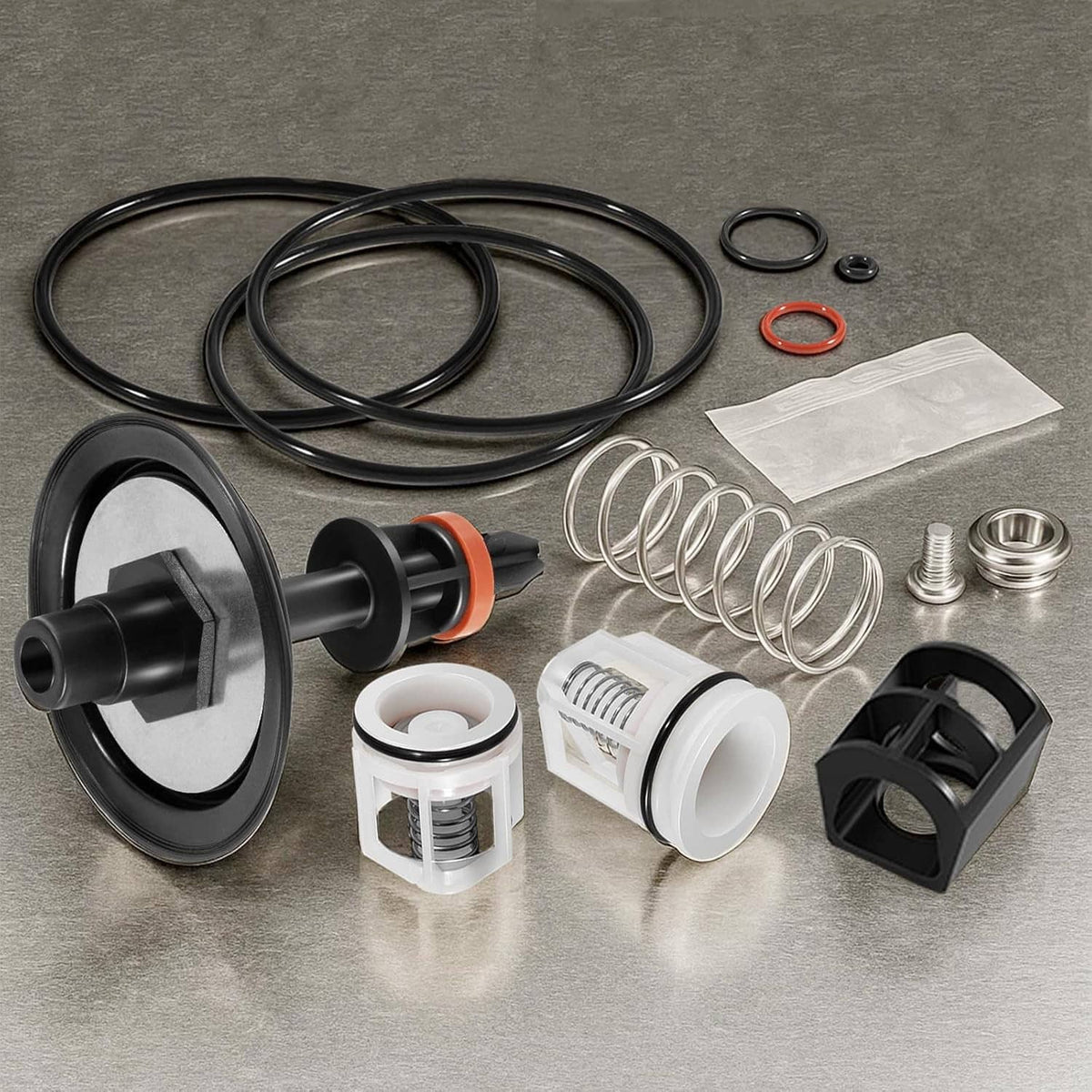 1-inch backflow preventer repair kit with black valve parts, orange stem, springs, and seals