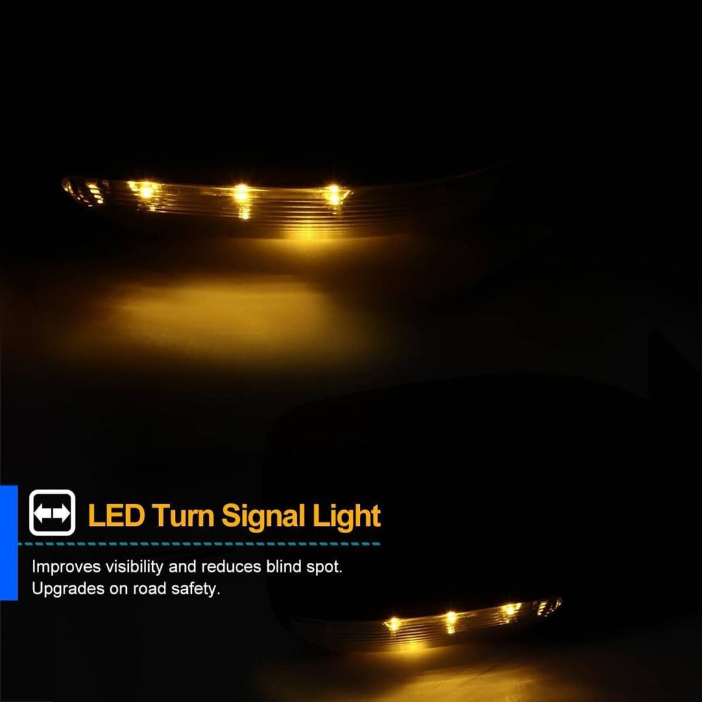 Black side mirror with illuminated LED turn signal light at night