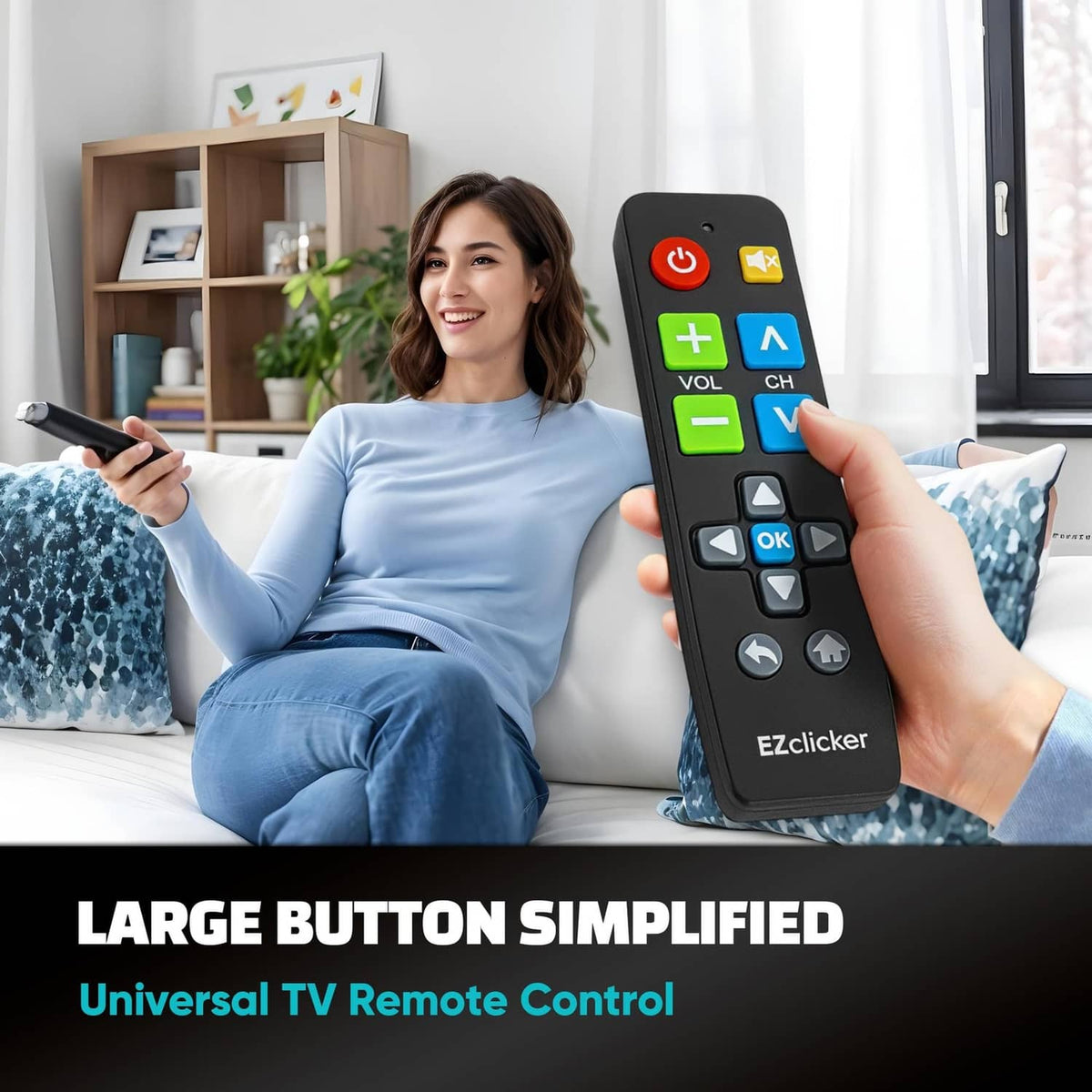 Black universal TV remote with large colored buttons, held in hand, EZclicker logo