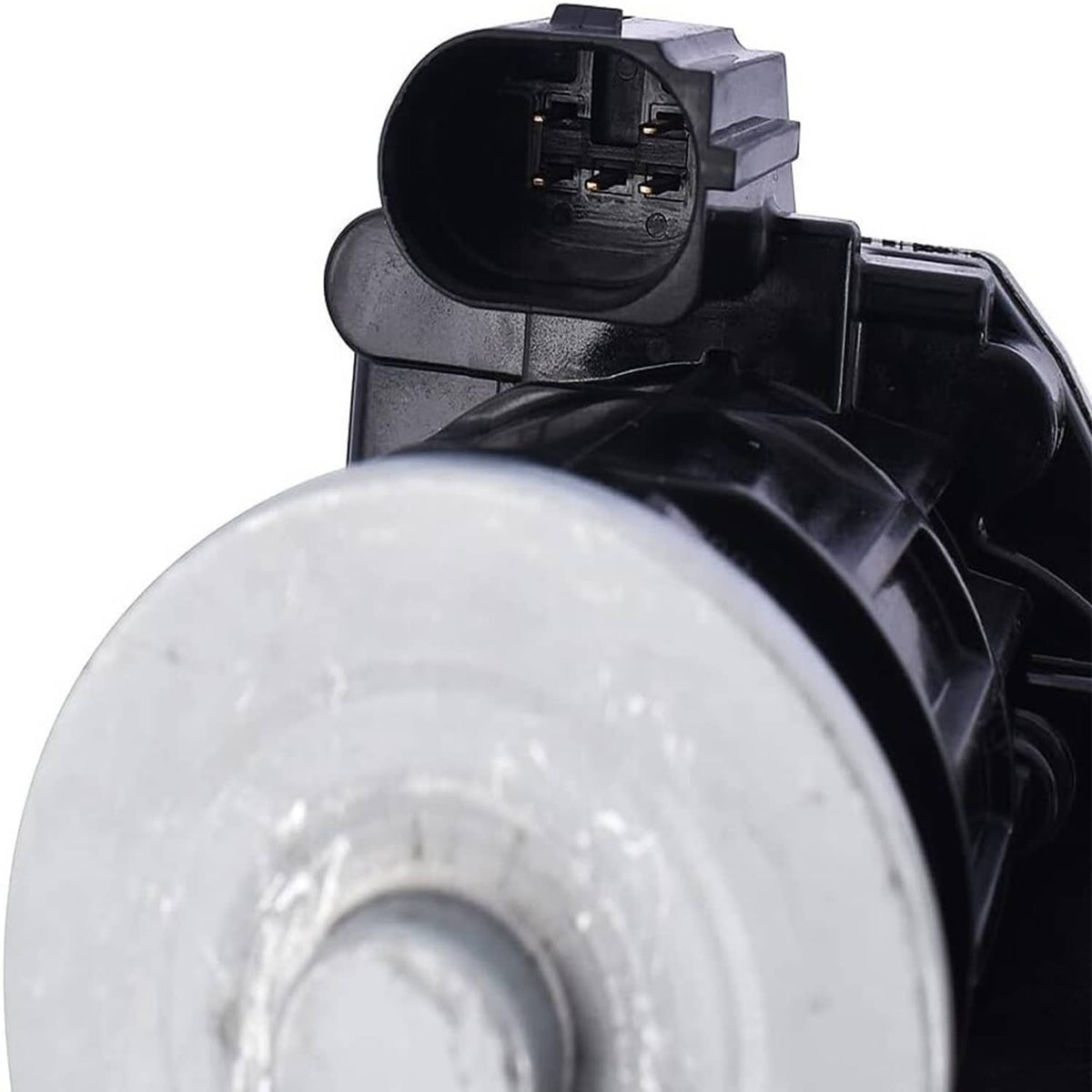 Turbocharger inlet area with black plastic housing and round metal flange, close-up