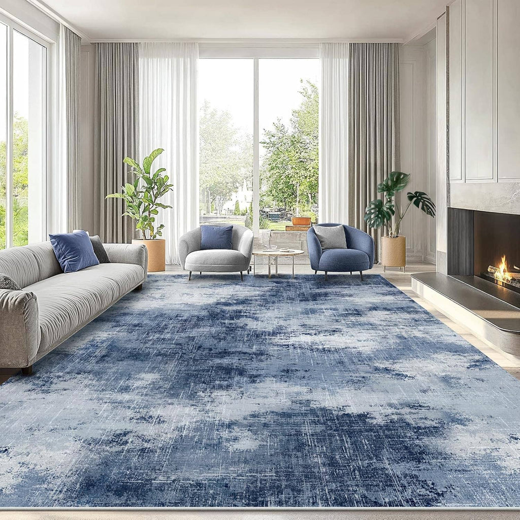 Rectangular blue area rug with faded-look abstract design and textured surface