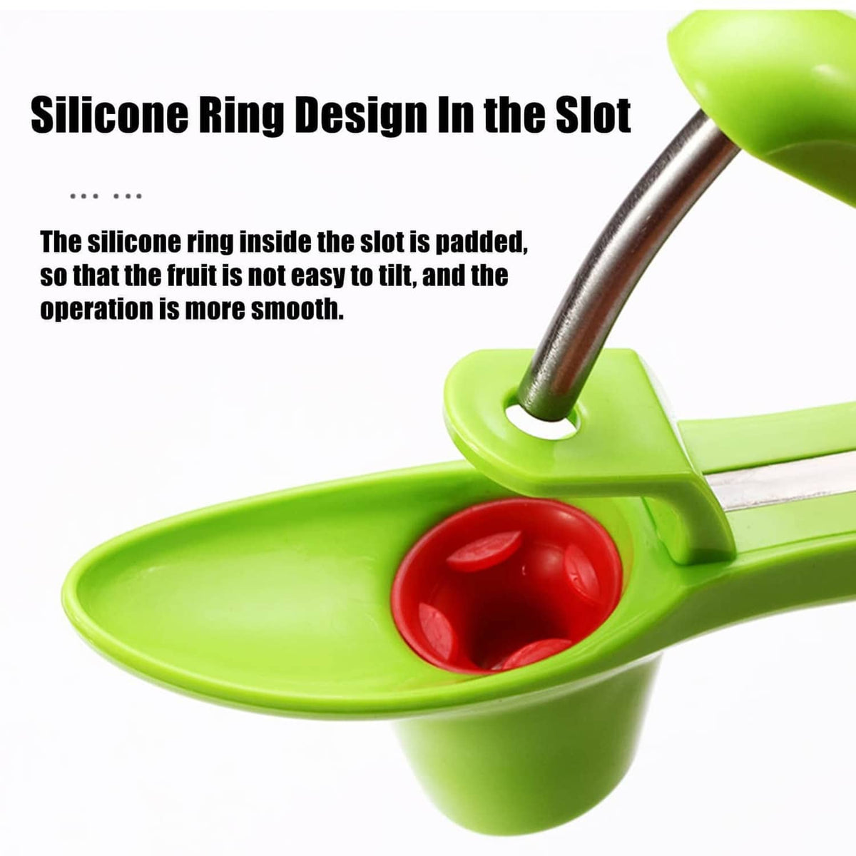Green cherry pitter tool with silicone ring in the slot and metal prongs over cup