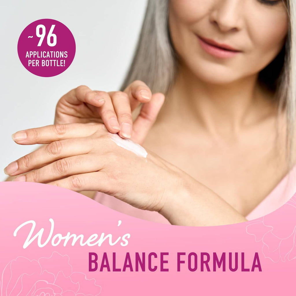 Woman applying white cream to forearms with hands