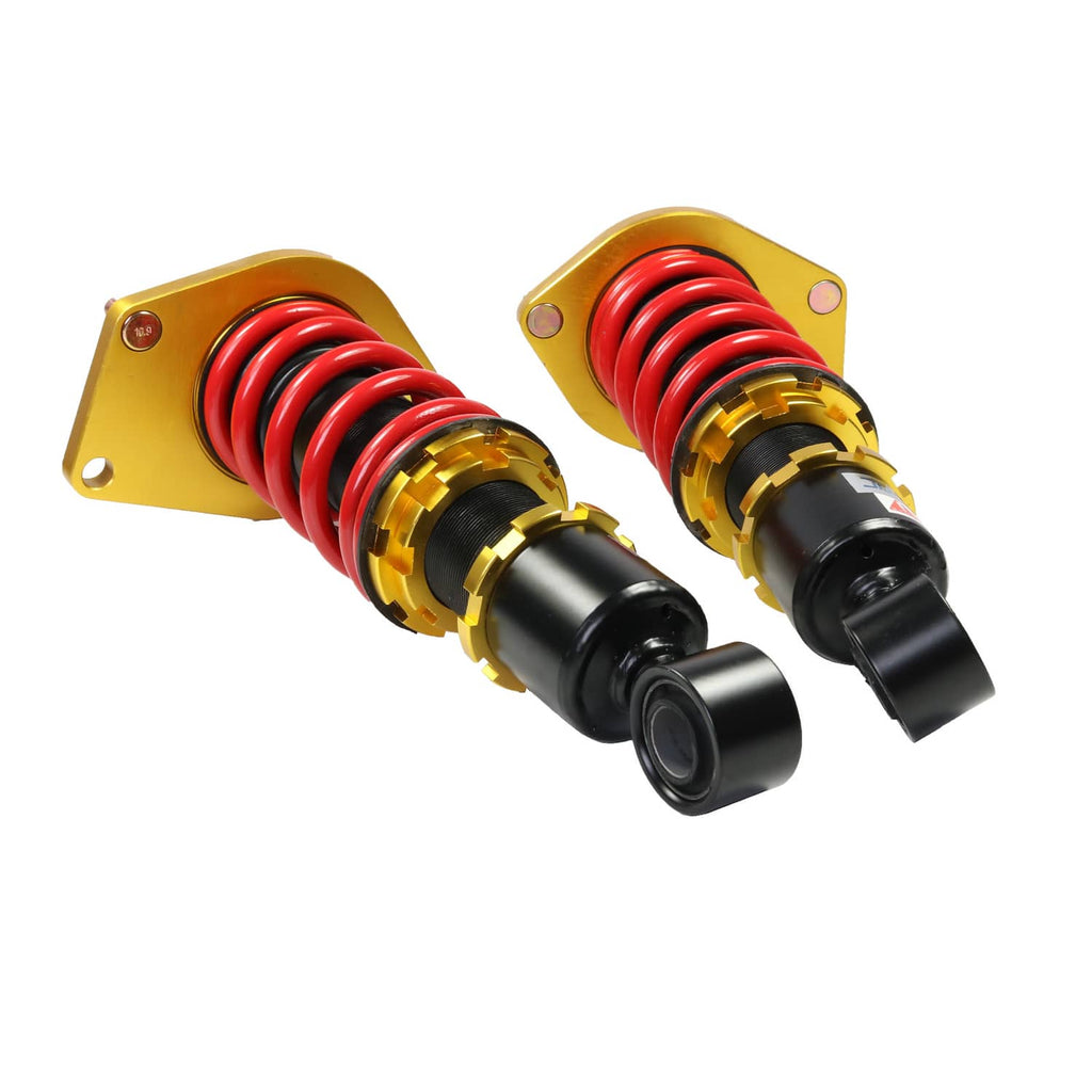 Adjustable coilover strut shock absorbers with red springs, gold collars, black bodies