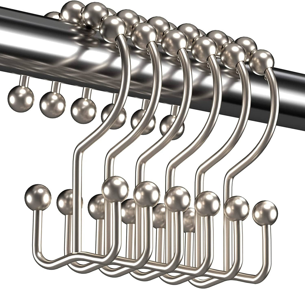 Set of silver double-glide shower curtain hook rings with ball sliders on a rod