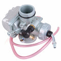 Carburetor assembly with silver body, black intake boot, and pink fuel line hoses