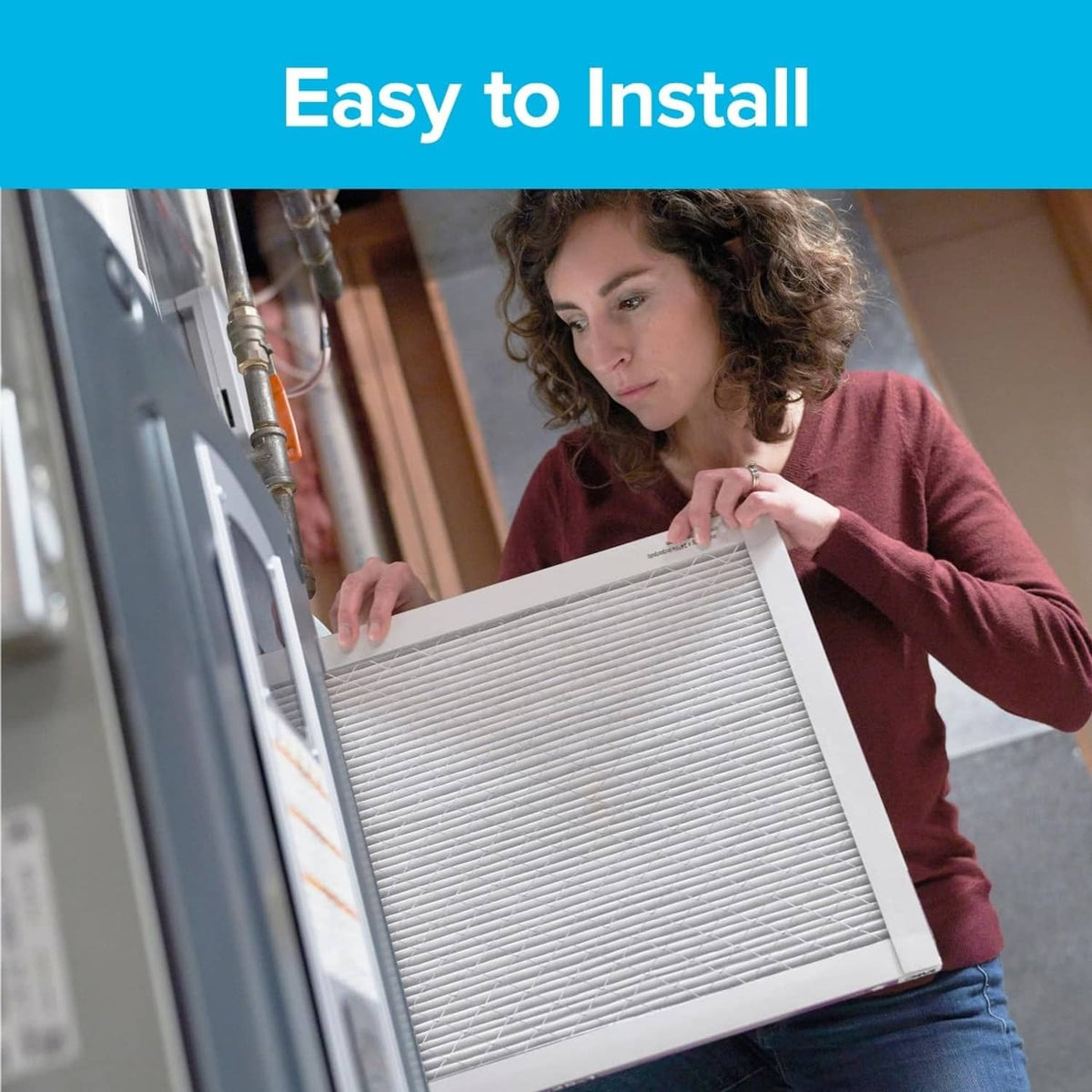 Air filter held for installation, showing pleated white filter media in a frame