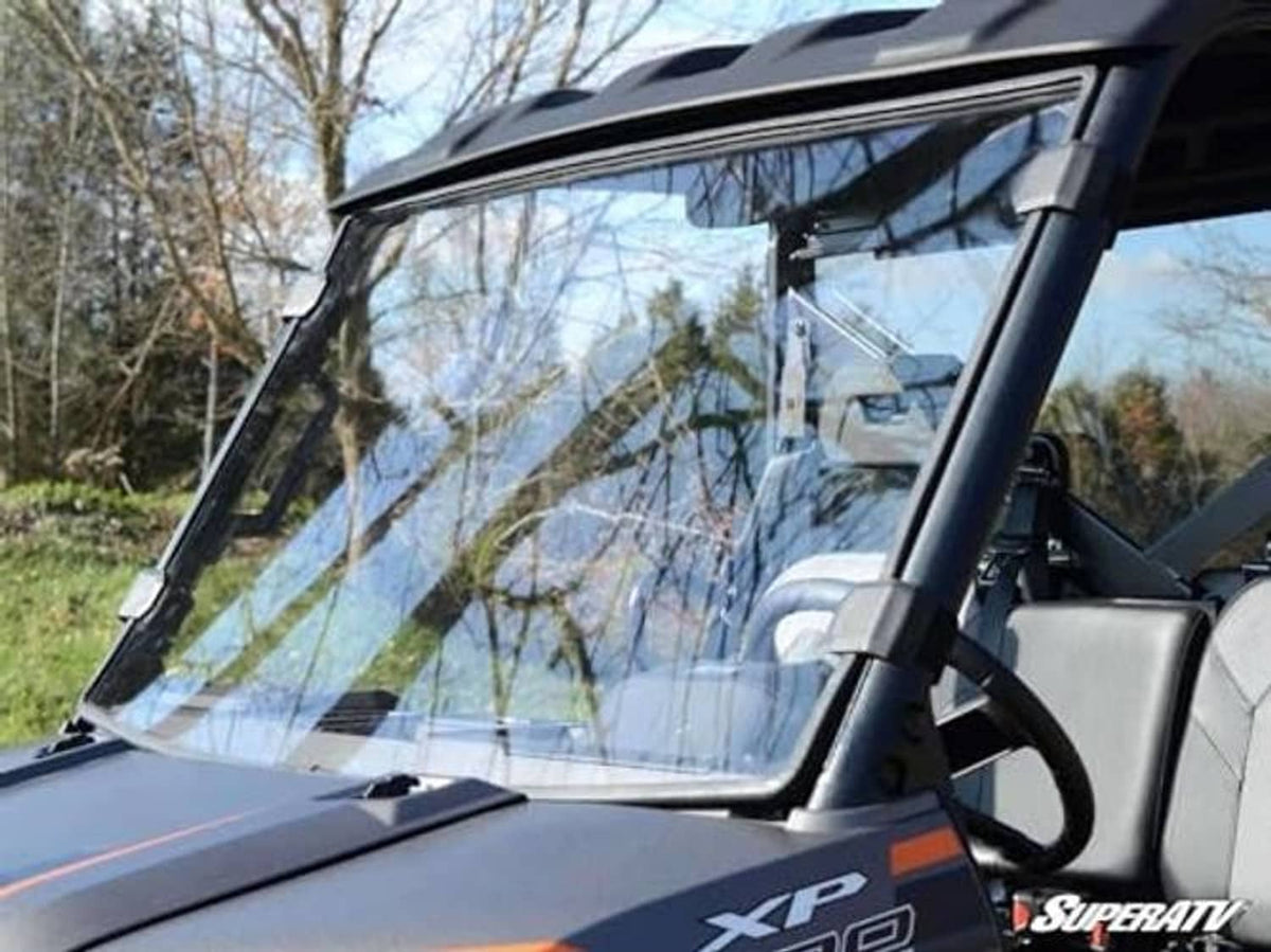 Clear windshield panel and frame on Polaris Ranger XP 900, close-up detail