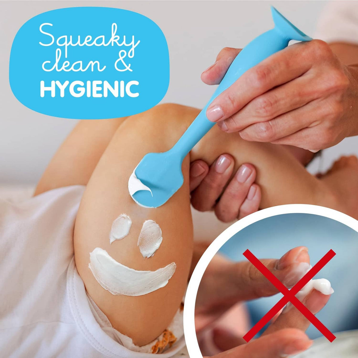 Blue silicone baby bum brush held in hand with suction base.
