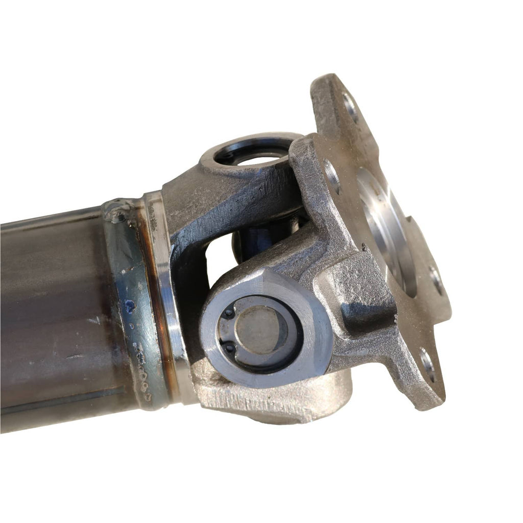 Rear drive shaft assembly end yoke with bearing housing and metal flange