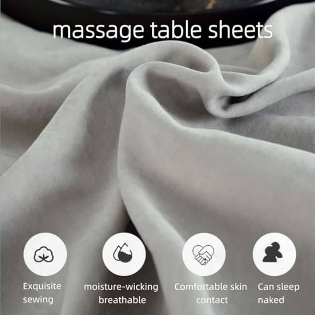 Grey massage table sheet fabric with soft folds and smooth surface