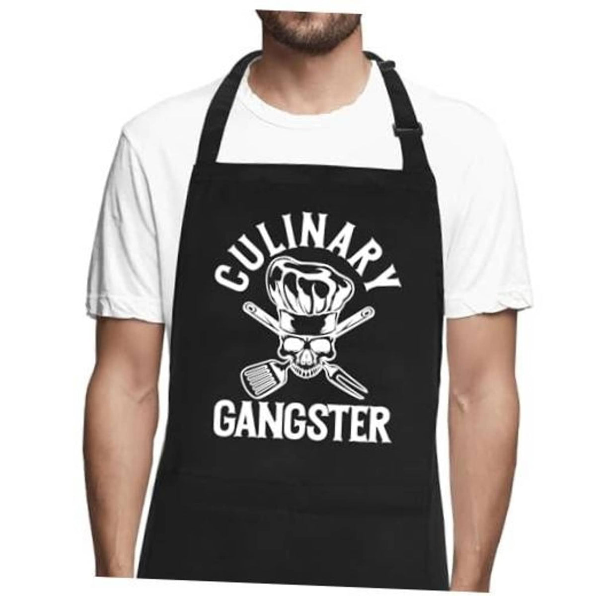 Black chef apron with skull and utensils graphic, front straps and bib fit.