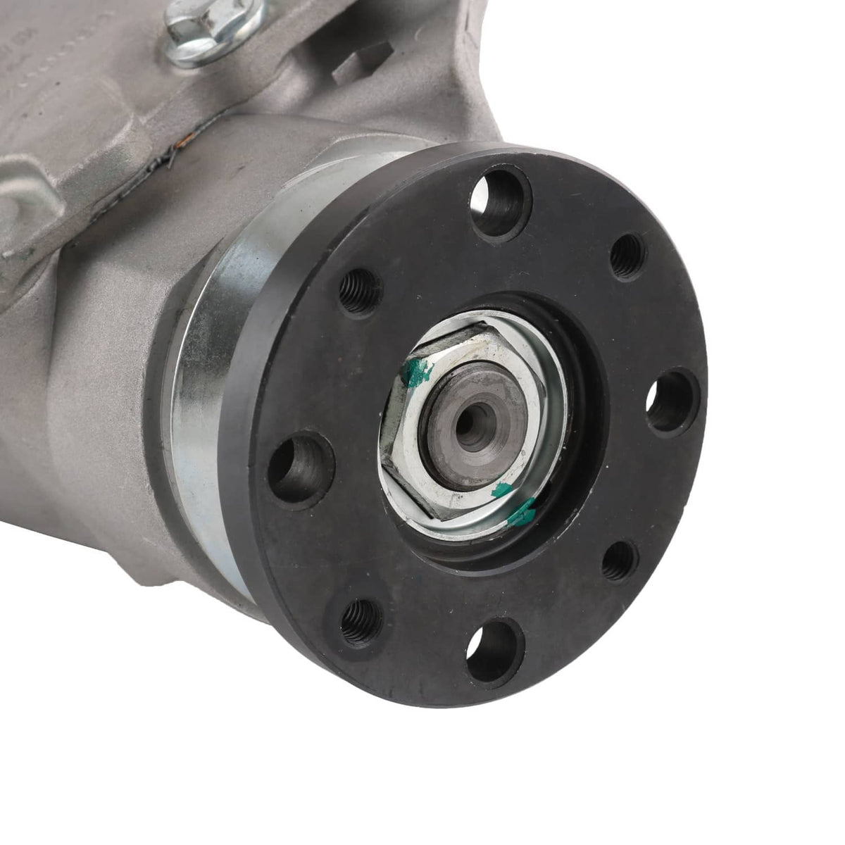 Close-up of front differential carrier assembly with black flange and axle hub center