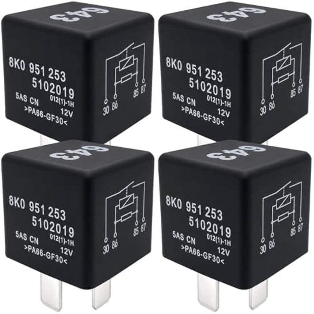 Set of four black automotive relays, each with white label text and two plug prongs