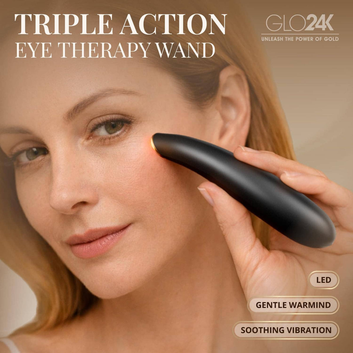 Black GLO24K heated eye wand touching under-eye area on a person’s face