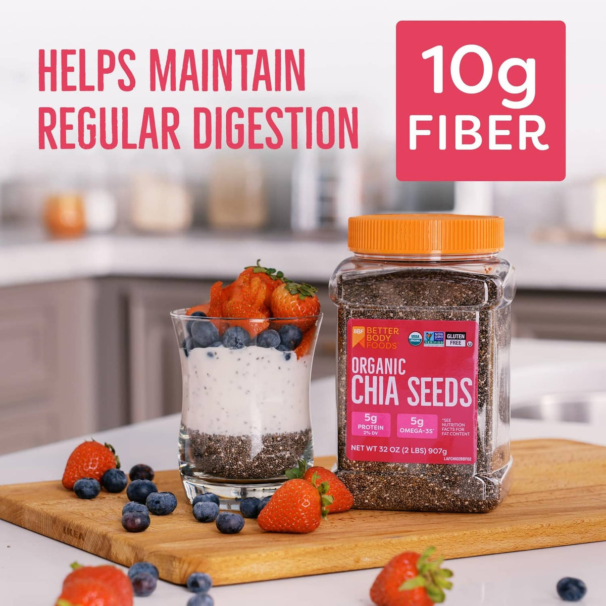 Organic chia seeds jar with orange cap on wooden board with berry yogurt cups