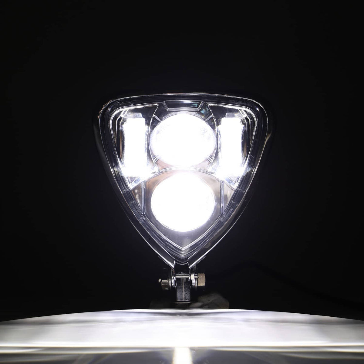 Chrome triangle motorcycle headlight assembly, front view with bright dual light output
