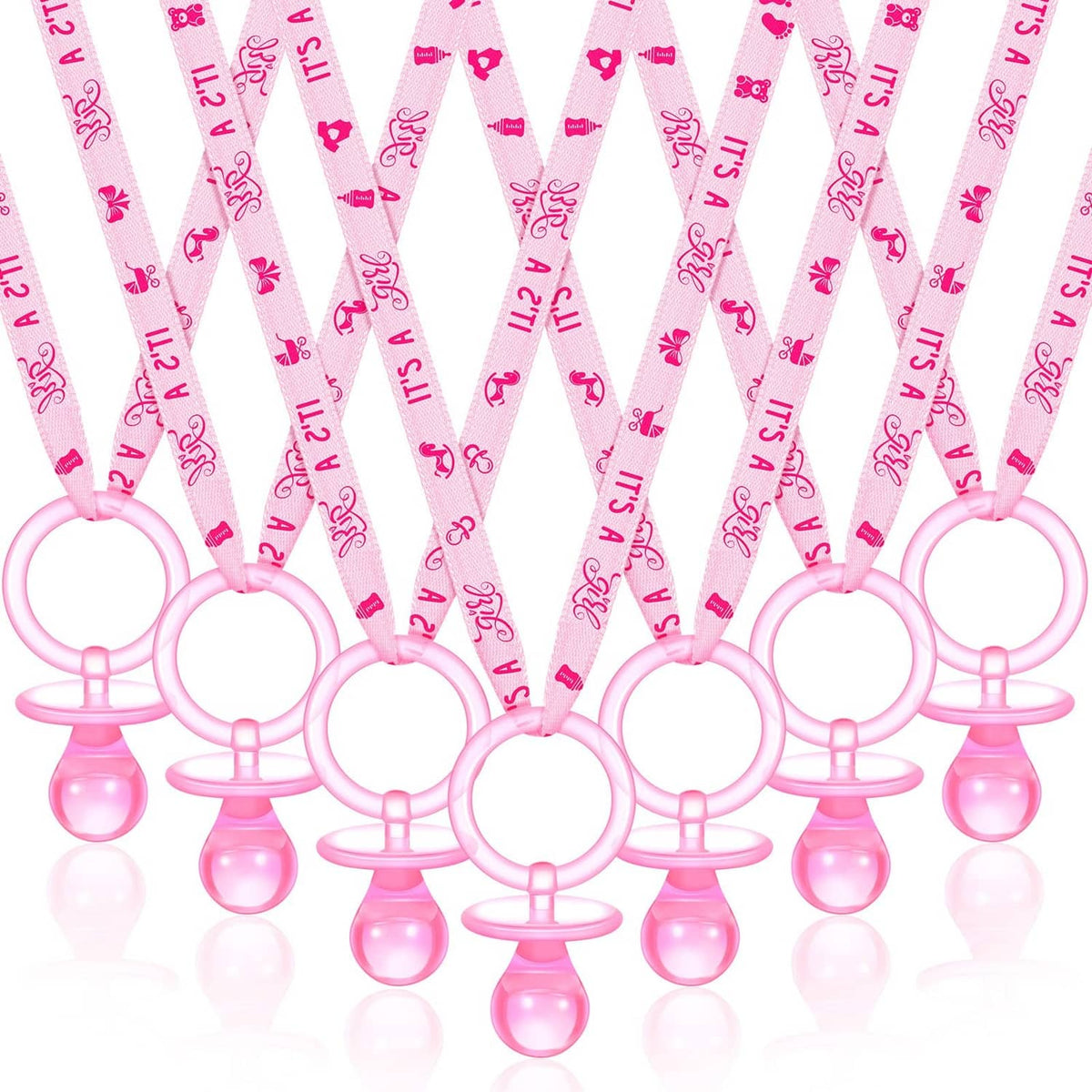 Pink pacifier charm necklaces with ring and bulb pendants, multiple pieces laid out