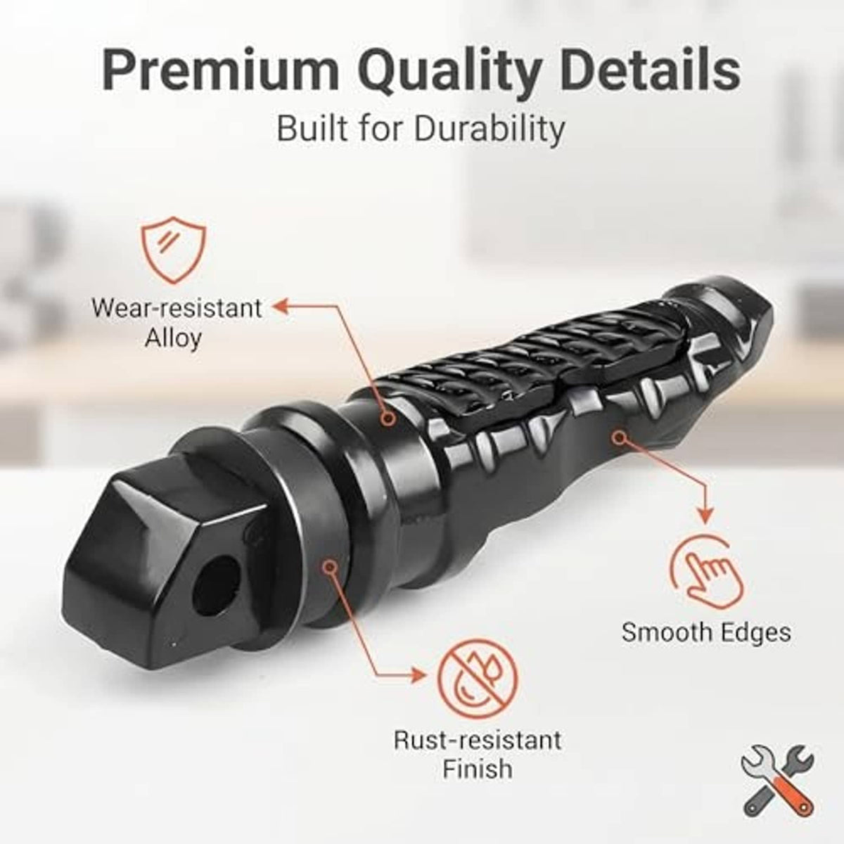 Black alloy motorcycle foot peg with rust-resistant finish, smooth edges, textured tread
