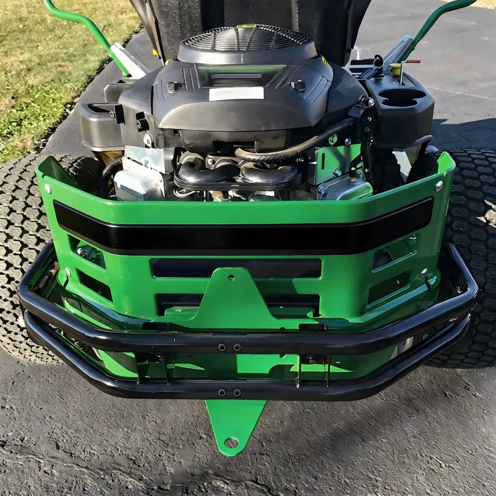 Rear bumper bar installed on a green riding mower frame, showing black bar and mount