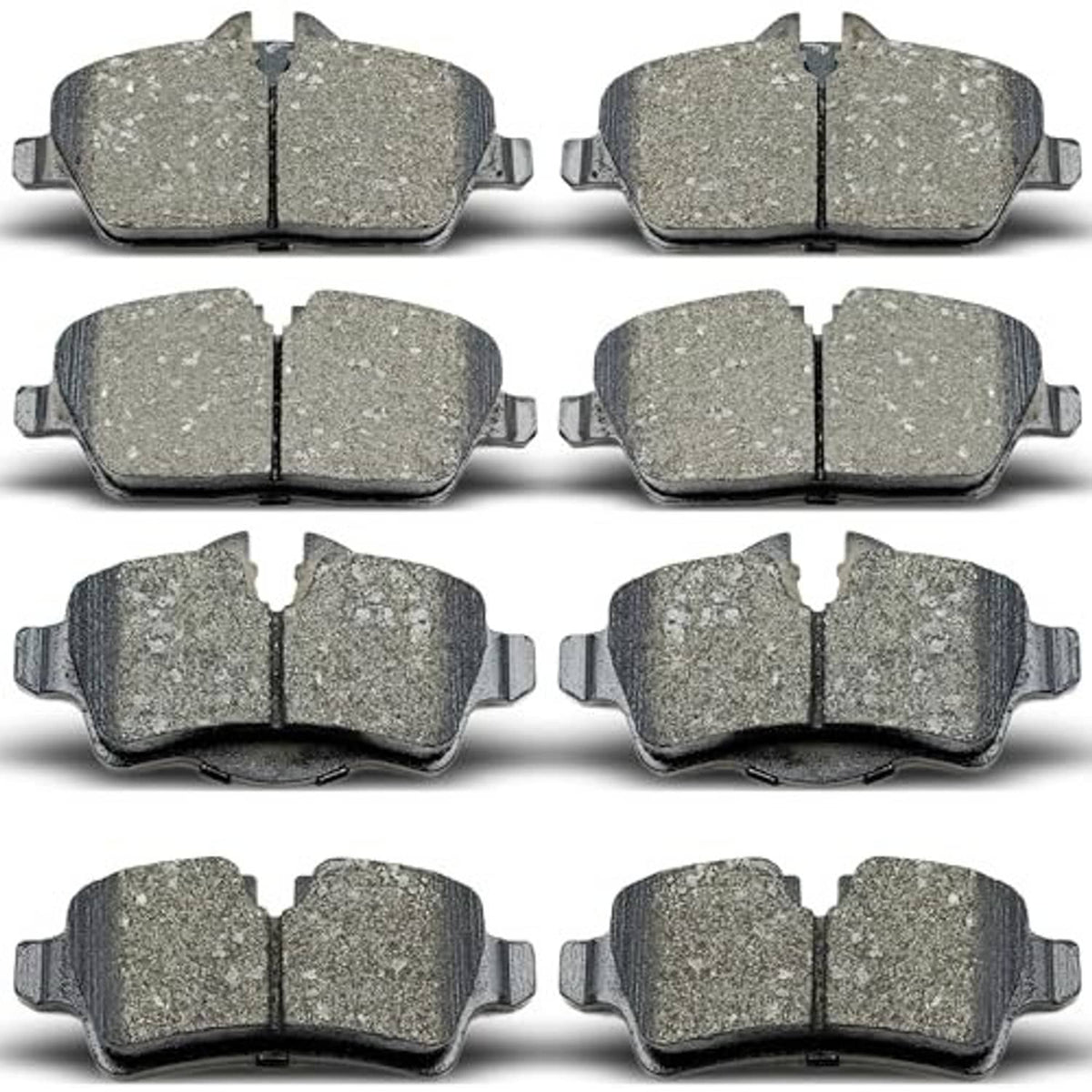 Ceramic brake pads set, array of grey friction pads with retaining metal clips