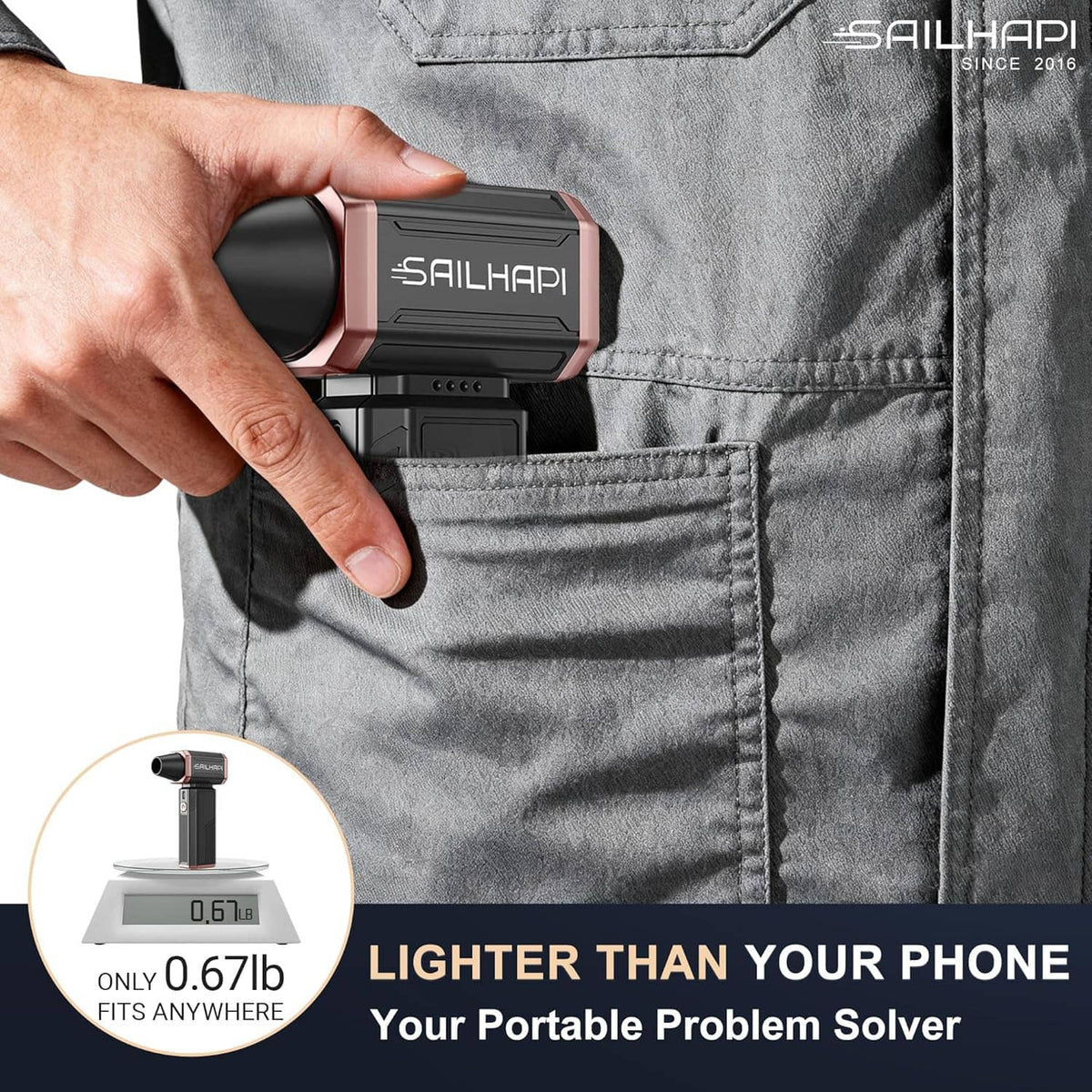 Pocket-sized cordless air duster held in hand with compact rose-and-black body
