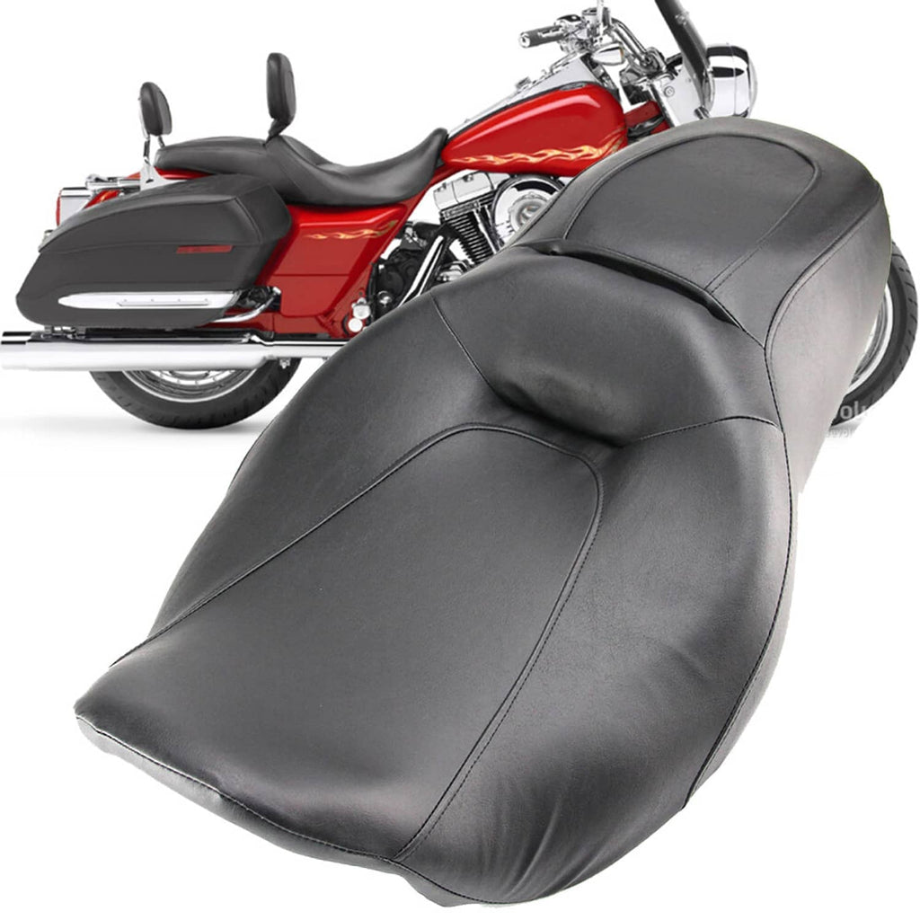 Black rider seat and passenger seat in one piece with curved shape and stitched seams.